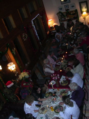 Most of adults seated at one long table