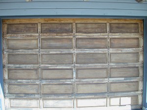 The garage door after stripping the old finish