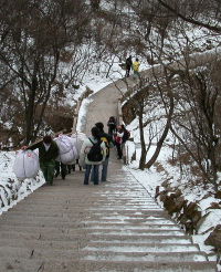 Laborers climbings steps near the spot where Ting's sister fell