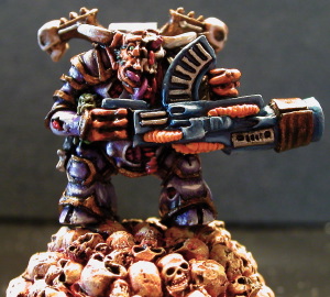 A Nurgle Chaos Lord armed with a Kai Gun