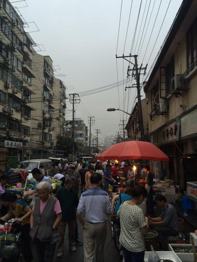 Streets can be crowded with small stands in Shanghai