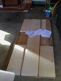 The open box of flat-pack shelving
